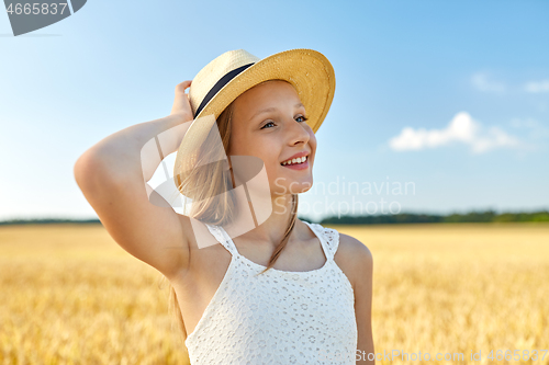 Image of portrait of girl in straw hat on field in summer