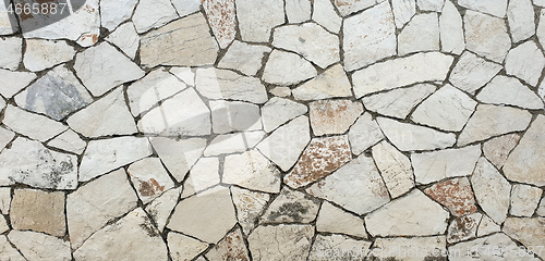 Image of Closeup of dry stone wall as background