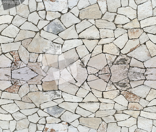 Image of Closeup of dry stone wall as seamless background