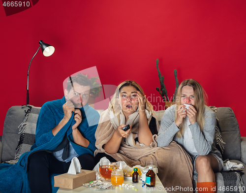 Image of Ill young people, friends or family with fever and cold look suffering at home