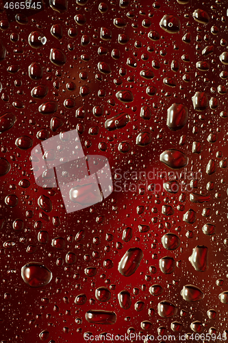 Image of Close up view of cold drops on the glass of beer