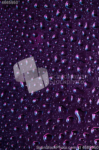 Image of Close up view of cold drops on the glass of beer