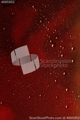 Image of Close up view of cold drops on the glass of beer