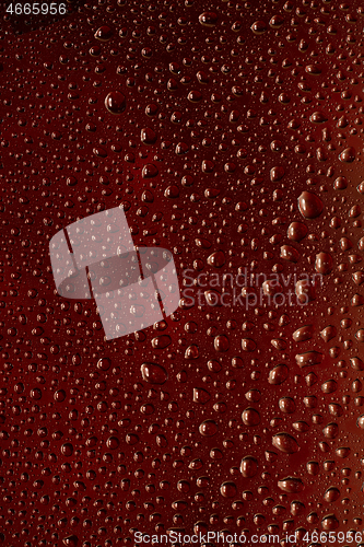 Image of Close up view of cold drops on the glass of beer