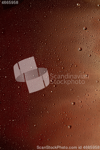 Image of Close up view of cold drops on the glass of beer