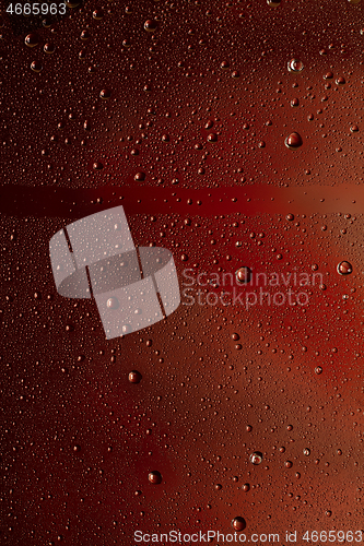 Image of Close up view of cold drops on the glass of beer