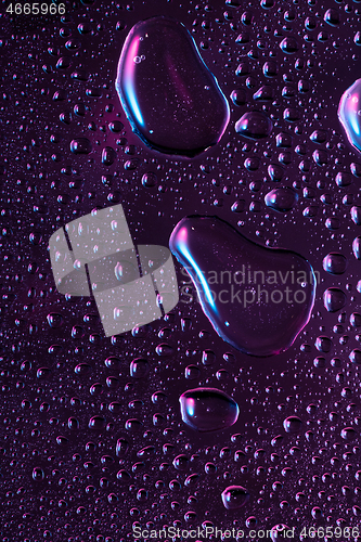 Image of Close up view of cold drops on the glass of beer