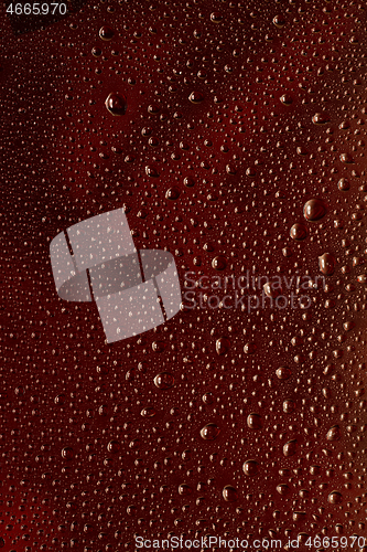 Image of Close up view of cold drops on the glass of beer