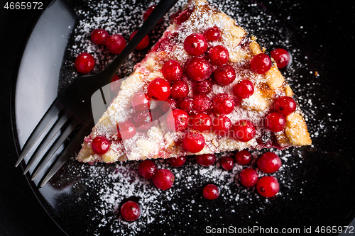 Image of Homemade vegan red currant cake on black