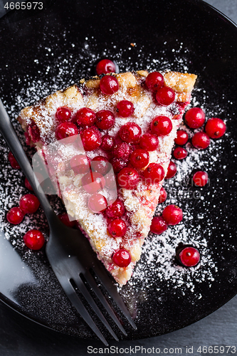 Image of Homemade vegan red currant cake on black