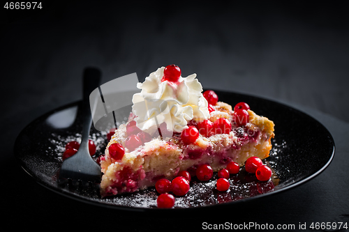 Image of Homemade vegan red currant cake on black