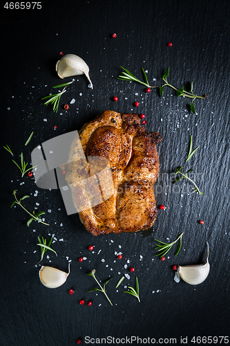 Image of Grilled pork steak with spices, herbs and garlic