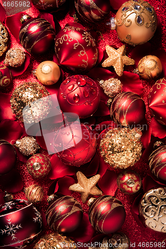 Image of Christmas ornaments and baubles in red and golden tone 