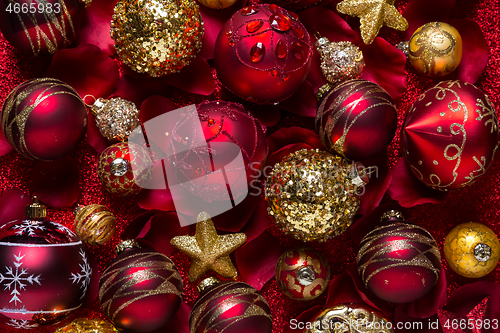 Image of Christmas ornaments and baubles in red and golden tone 