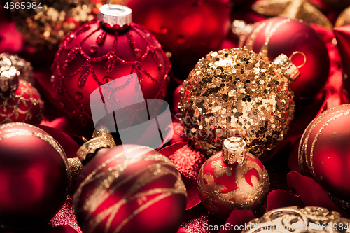 Image of Christmas ornaments and baubles in red and golden tone 