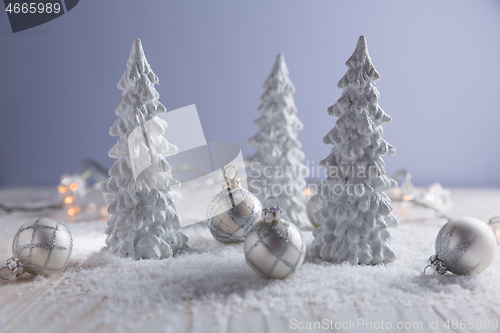 Image of White trees with small Christmas balls as snowy landscape