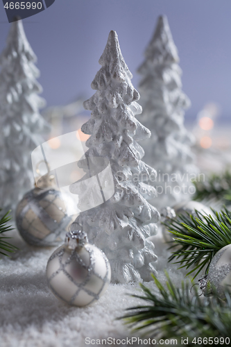 Image of White trees with small Christmas balls as snowy landscape