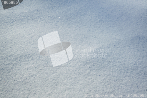 Image of Fresh snow with morning sunlight as background