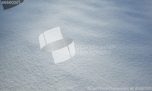 Image of Fresh snow with morning sunlight as background