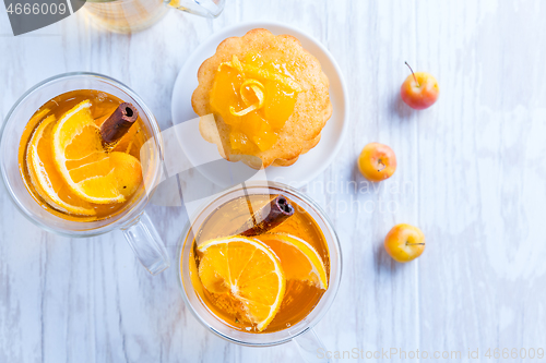 Image of Apple cider cocktail with cinnamon and small lemon curd tarts