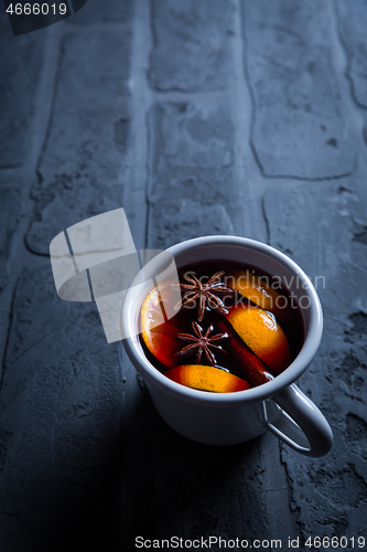 Image of Spicy mulled wine with orange, cinnamon and anise in mug