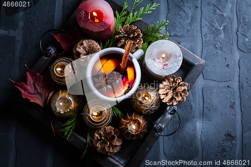 Image of Spicy mulled wine with orange, cinnamon and anise in mug