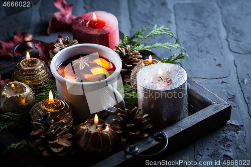 Image of Spicy mulled wine with orange, cinnamon and anise in mug