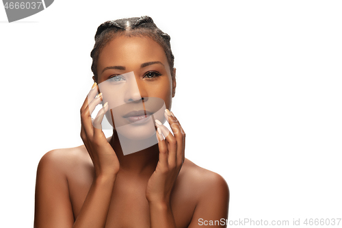 Image of Portrait of beautiful african-american woman isolated on white studio background. Beauty, fashion, skincare, cosmetics concept.