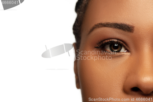 Image of Portrait of beautiful african-american woman isolated on white studio background. Beauty, fashion, skincare, cosmetics concept.