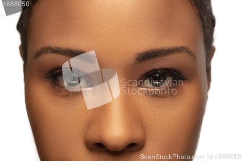 Image of Portrait of beautiful african-american woman isolated on white studio background. Beauty, fashion, skincare, cosmetics concept.