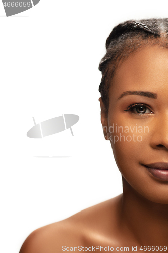 Image of Portrait of beautiful african-american woman isolated on white studio background. Beauty, fashion, skincare, cosmetics concept.