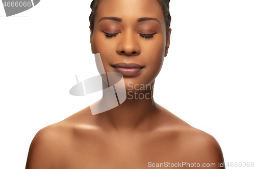 Image of Portrait of beautiful african-american woman isolated on white studio background. Beauty, fashion, skincare, cosmetics concept.