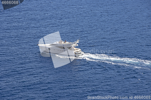 Image of A group of  people sail on luxury motor boat