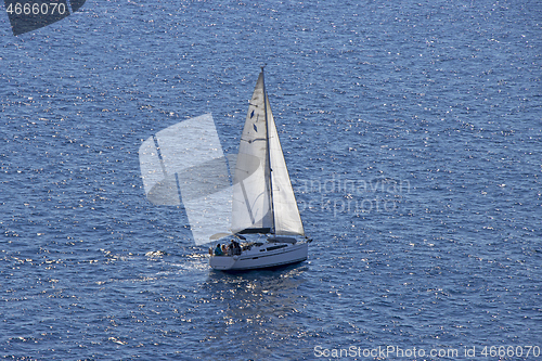 Image of Small Sailing boat yacht in the open blue Sea