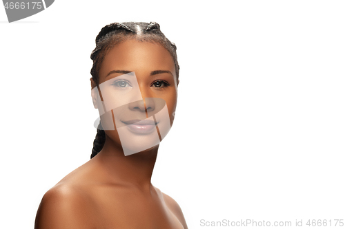 Image of Portrait of beautiful african-american woman isolated on white studio background. Beauty, fashion, skincare, cosmetics concept.