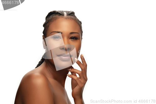 Image of Portrait of beautiful african-american woman isolated on white studio background. Beauty, fashion, skincare, cosmetics concept.