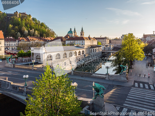 Image of Aerial drone panoramic view of Ljubljana medieval city center, capital of Slovenia in warm afternoon sun. Empty streets during corona virus pandemic social distancing measures