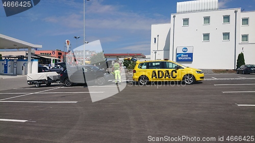 Image of BAD RAPPENAU, GERMANY- JULY 21, 2020: The ADAC General German Automobile Club service man from yellow car helps motorists in trouble.