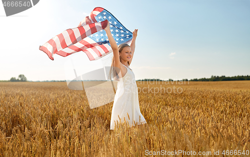 Image of girl with american flag waving over cereal field