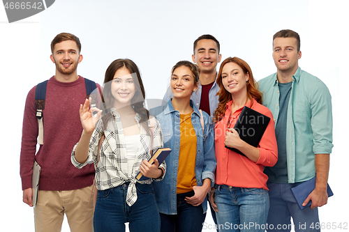 Image of group of smiling students showing ok hand sign