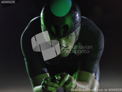 Image of triathlon athlete riding bike at night