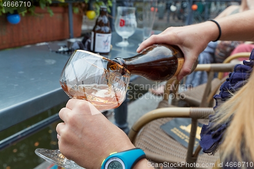 Image of Trappist beer poured in a glass in The Netherlands