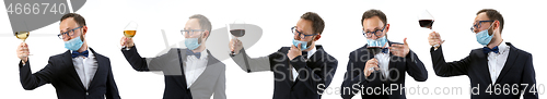 Image of Portrait of male sommelier in suit isolated over white background