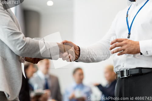 Image of handshake of people at business conference