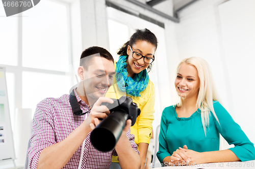 Image of photographers with camera at photo studio