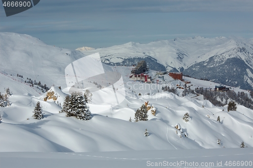 Image of Skiing slopes, with many people