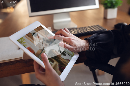 Image of Woman choosing what to watch at home during insulation, COVID-19 quarantine