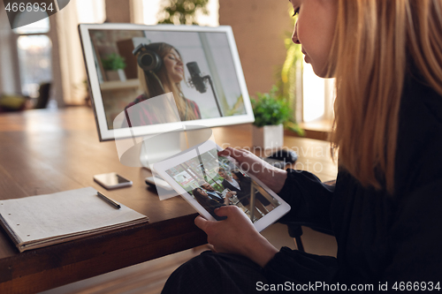 Image of Woman choosing what to watch at home during insulation, COVID-19 quarantine