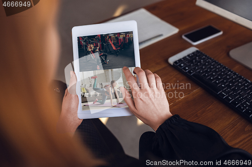 Image of Woman choosing what to watch at home during insulation, COVID-19 quarantine