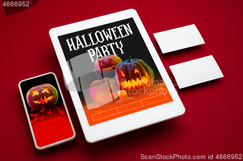 Image of Scary pumpkin on device screen background, mock up with copyspace